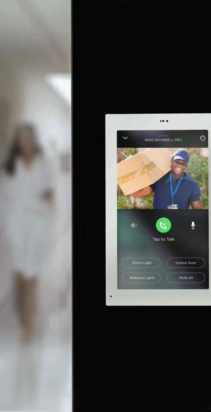 woman using her phone looking at surveillance screen