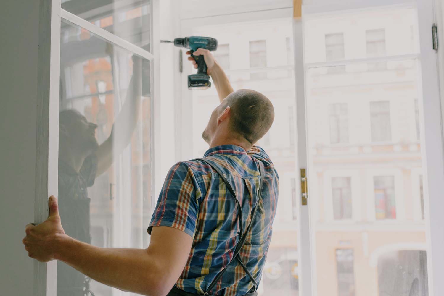 man installing a window
