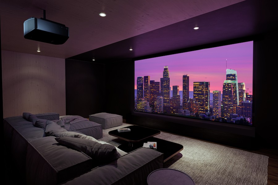 custom home theater installation featuring a large projection screen and projector installed on the ceiling.