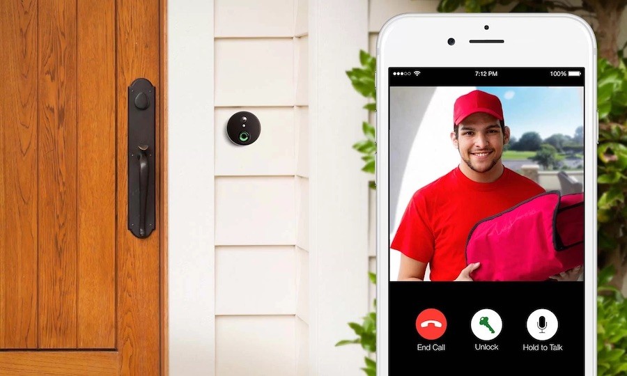 Front door with video doorbell and a closeup shot of a cell phone with surveillance footage.