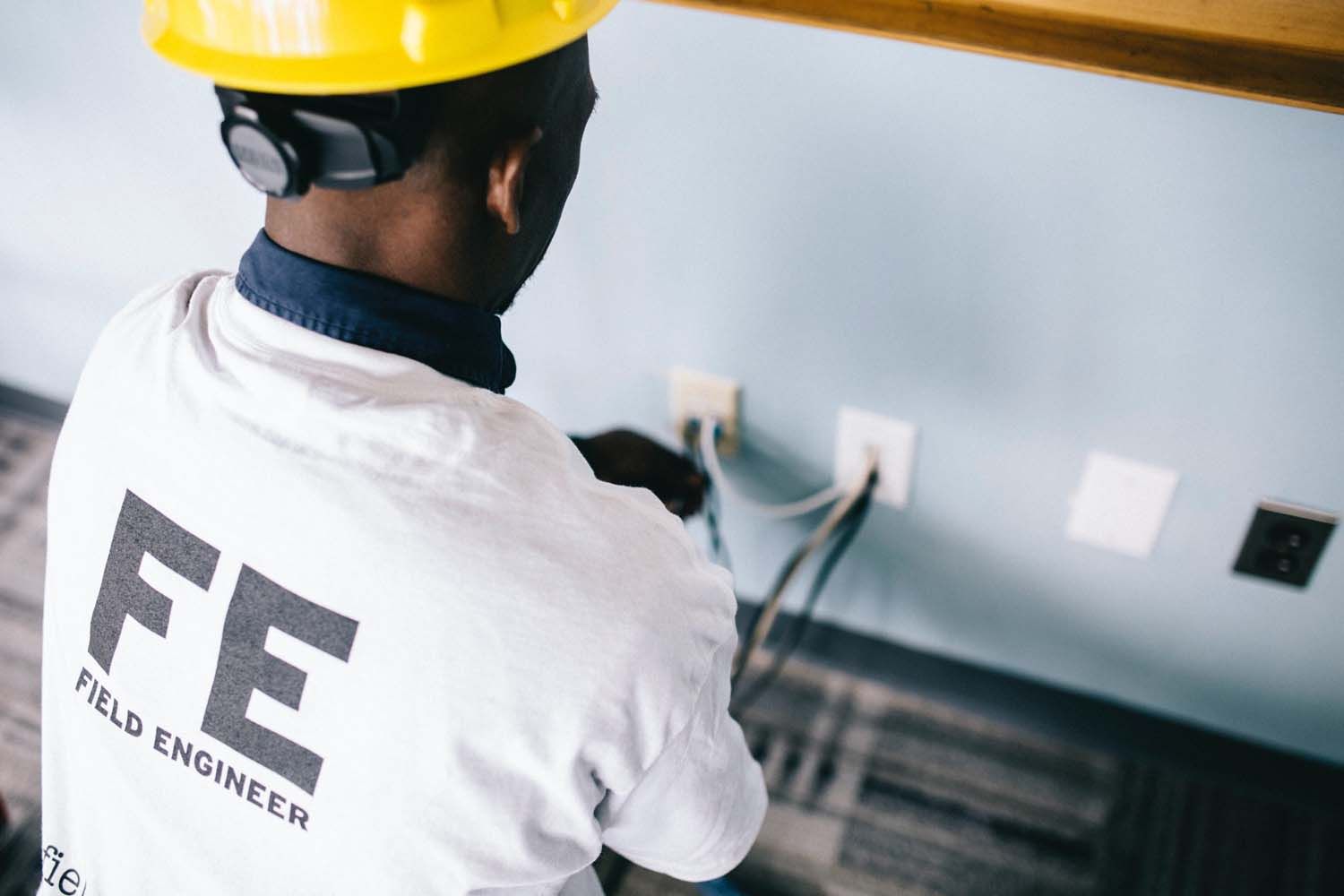 Engineer installing electric equipment
