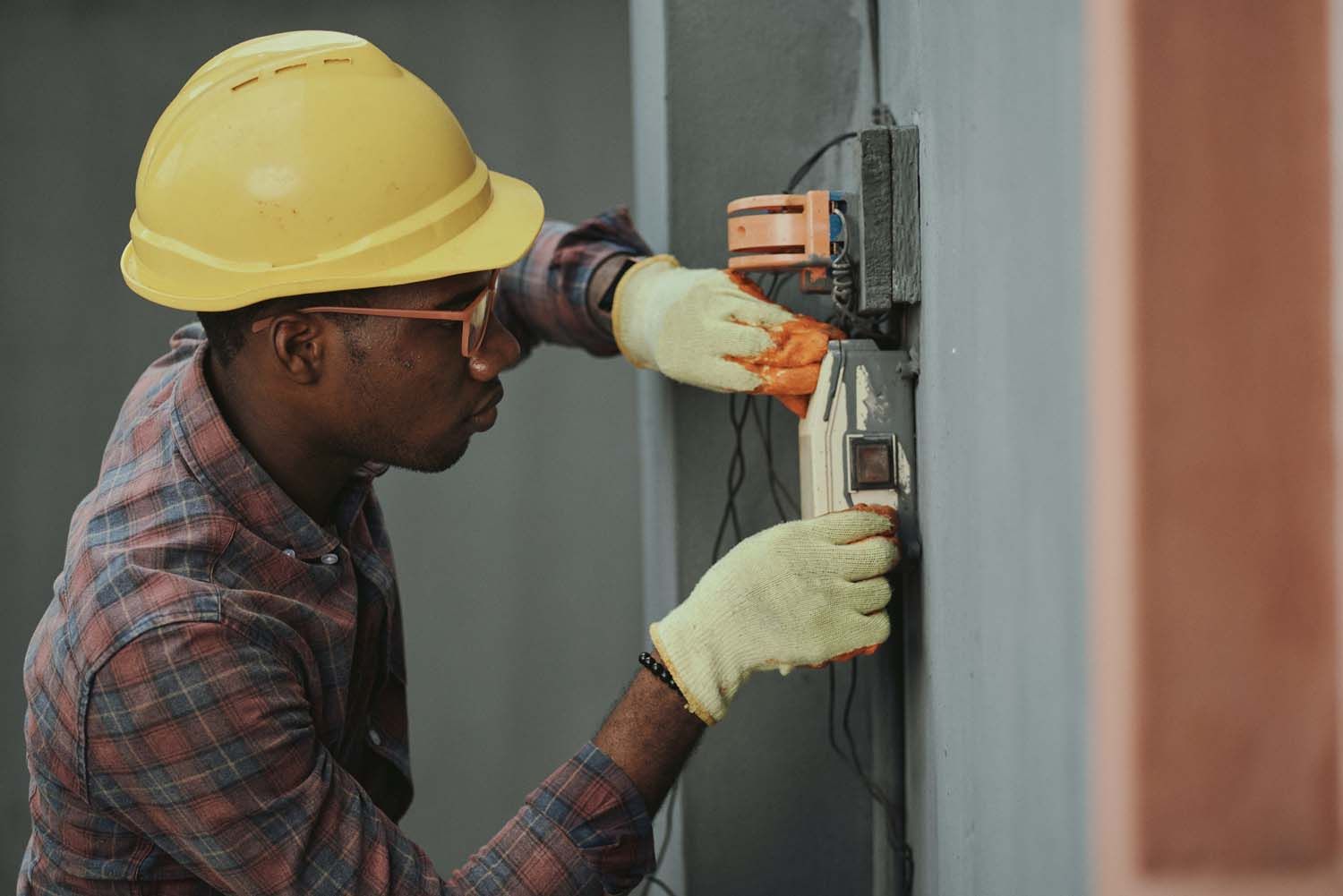 electrician working in an electrical box