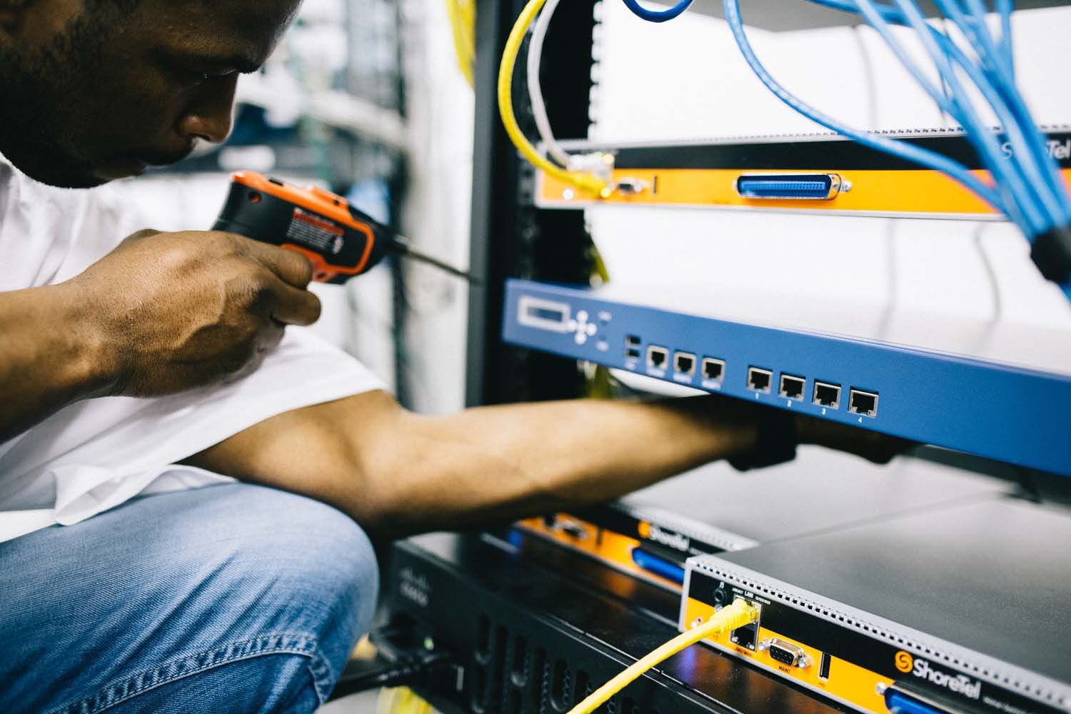 person installing networking equipment